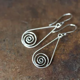 Long silver teardrop earrings with spirals inside